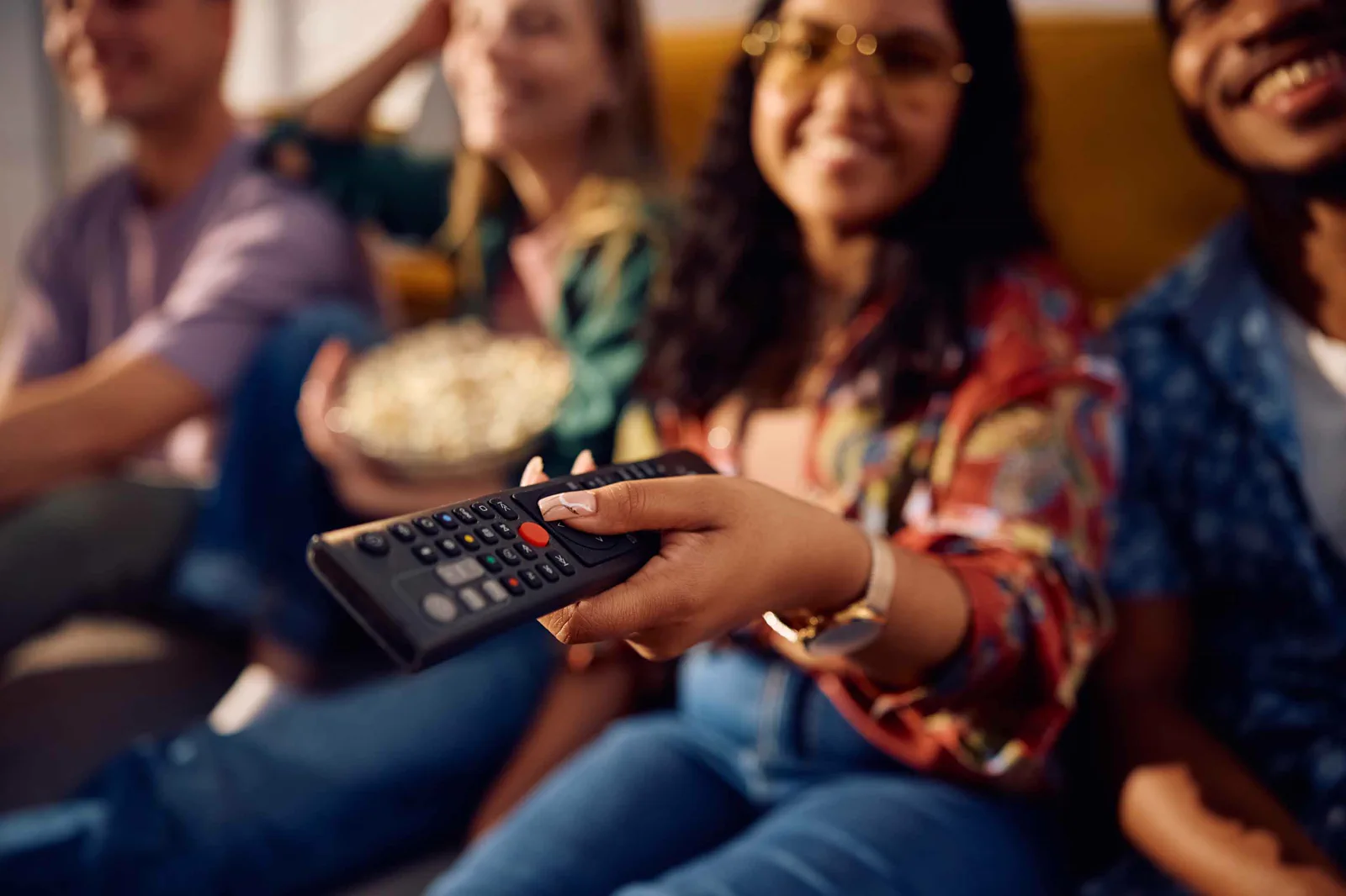 Friends watching television together